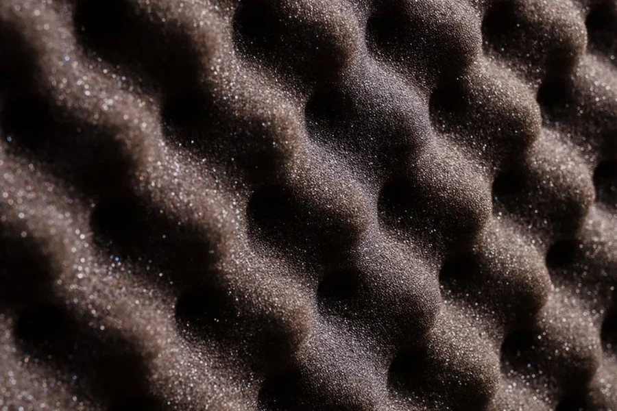 Microphone Isolation Shield Guide: Pros, Cons, and Setup Tips Dense dark grey acoustic foam panels on a studio wall